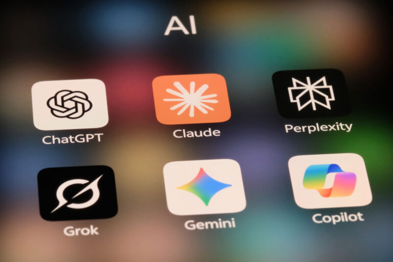 AI application icons for ChatGPT, Claude, Perplexity, Grok, Gemini, and Microsoft Copilot displayed on a screen.